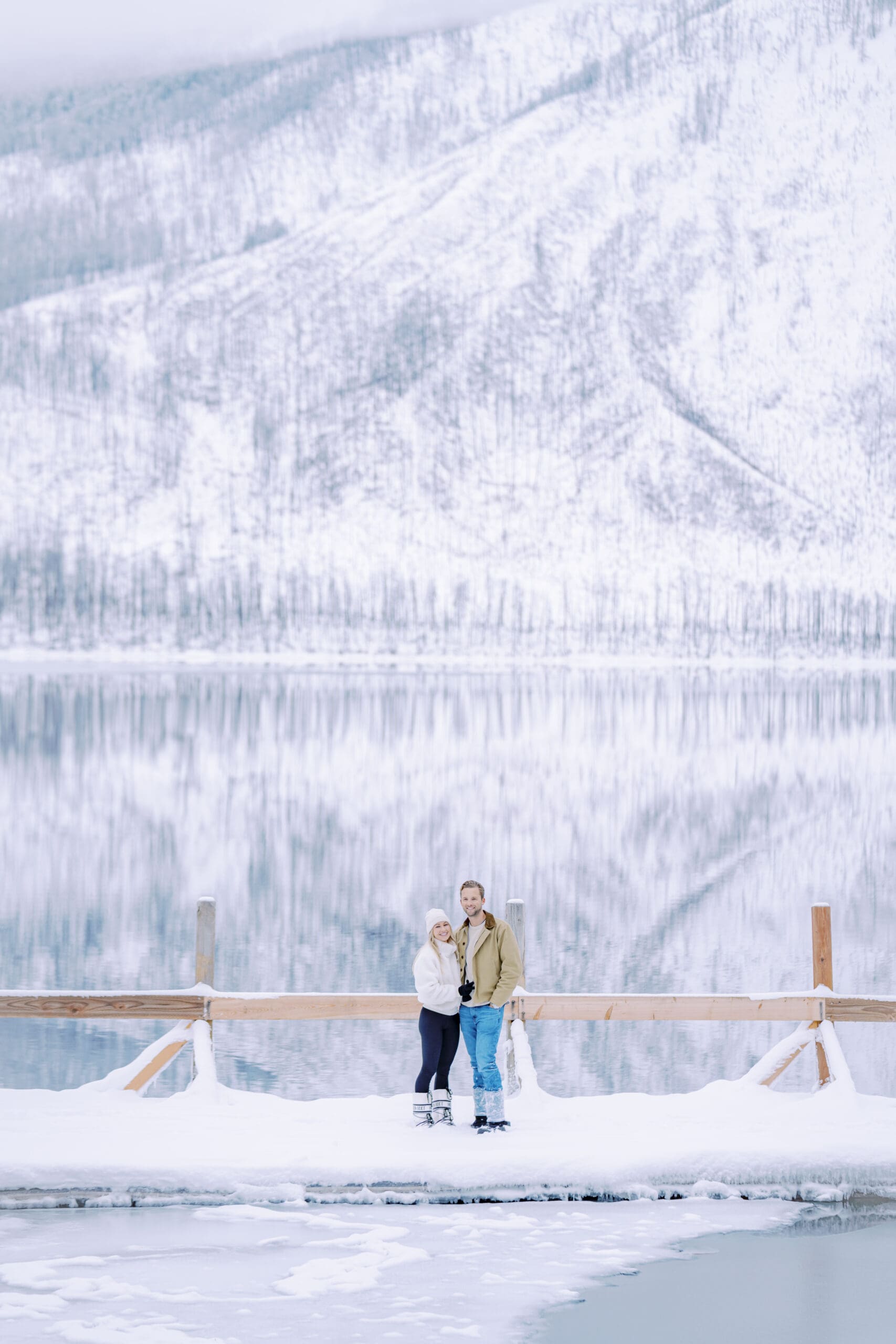 Glacier National Park surprise engagement in the heart of winter photograph by Joseph Mayden Photography