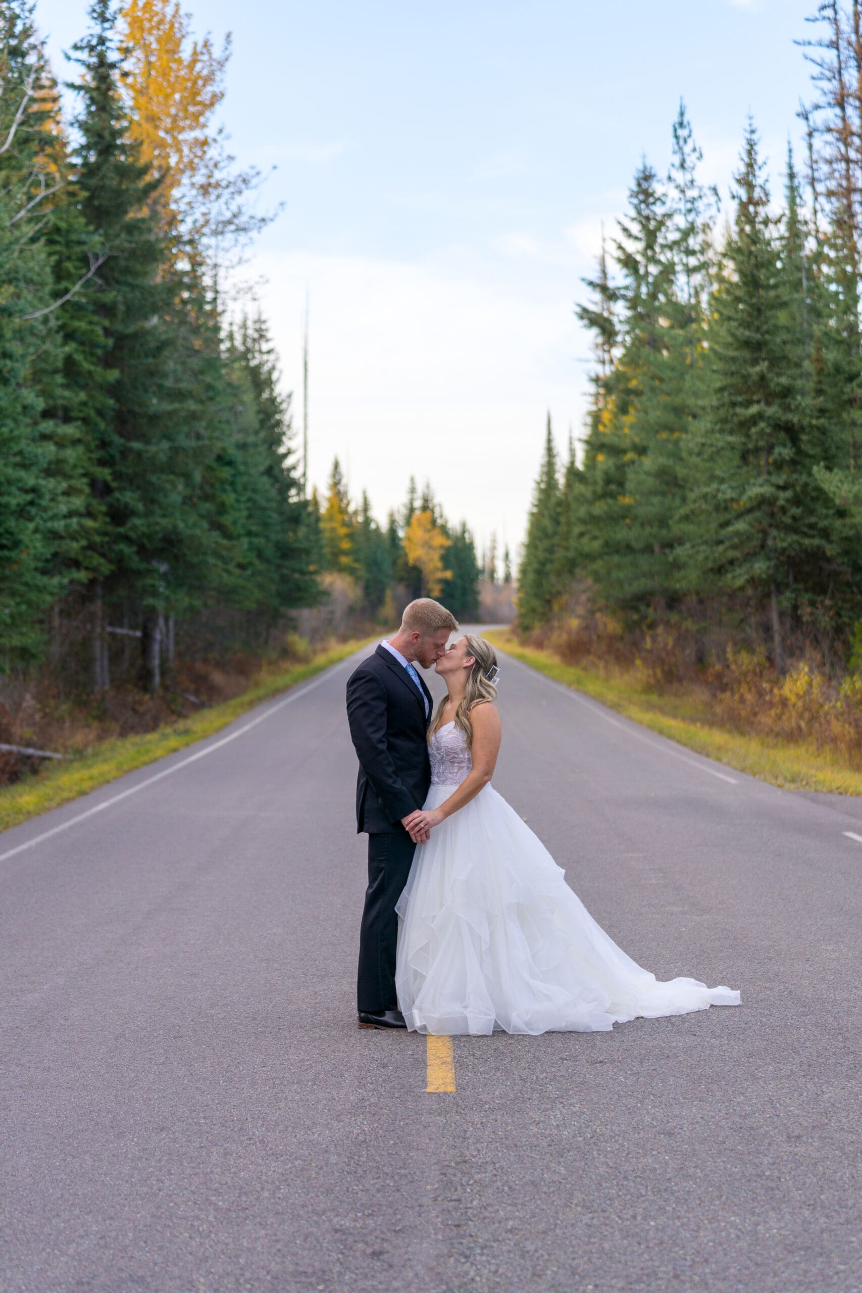 Elopement couple on Camas Road Glacier National Park with alpine views and mountain peaks.